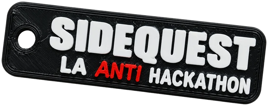 Llavero negro de Sidequest, La Anti Hackathon, con letras blancas y la palabra ANTI en rojo